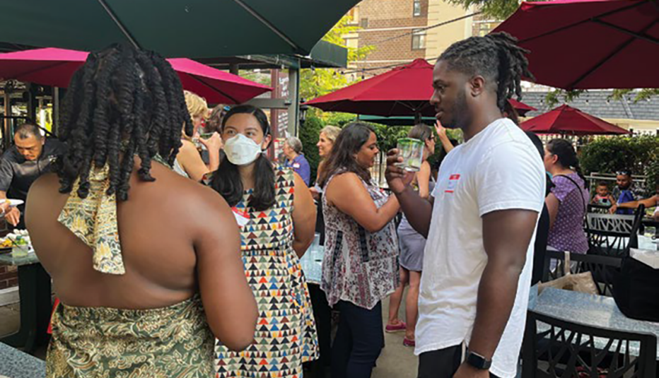 people at outdoor market people talking at outdoor market