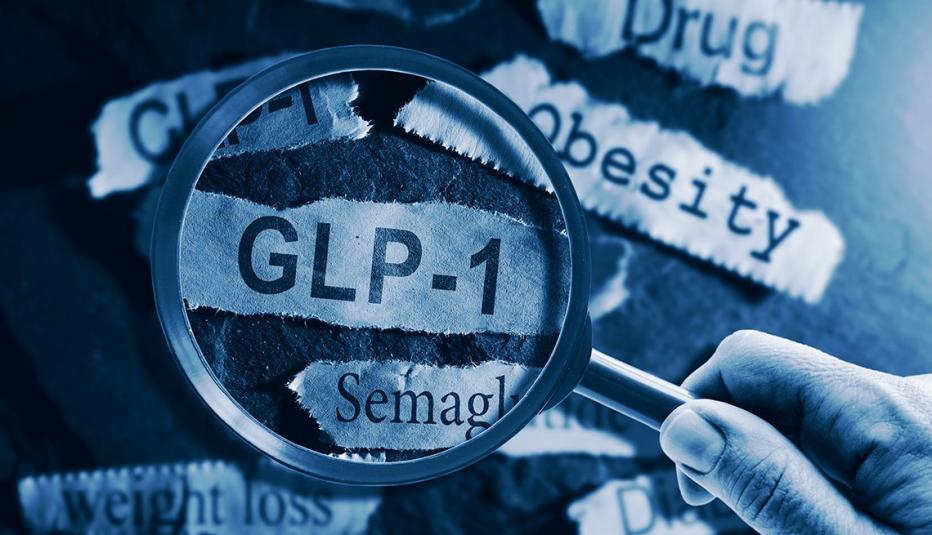 Focusing on GLP-1 GLP-1 related drugs newspaper headlines with hand and magnifying glass