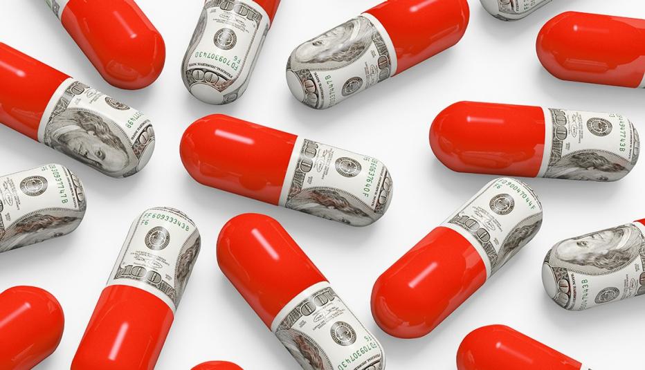 Multiple pill capsules. One of the pill is red, one half looks like a one hundred dollar bill Pill capsules wrapped in money scattered on a table