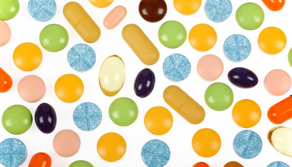 Various colorful pills and supplements on white background Various colorful pills and supplements on white background
