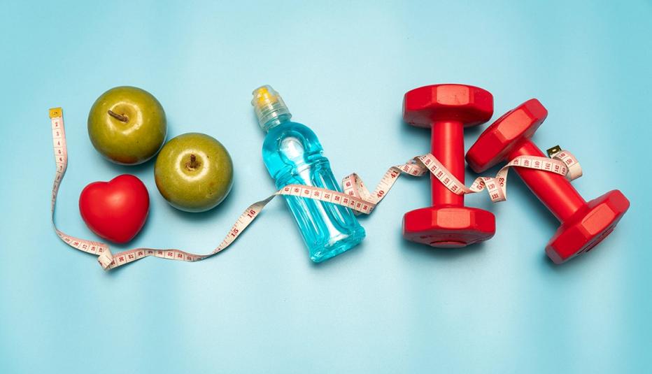 Fitness equipment. Healthy food. water, apple