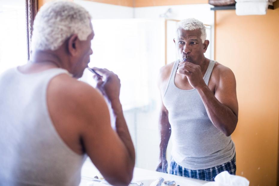 black-man-brushing-his-teeth black-man-brushing-his-teeth
