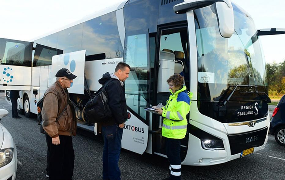 people waiting to get on bus