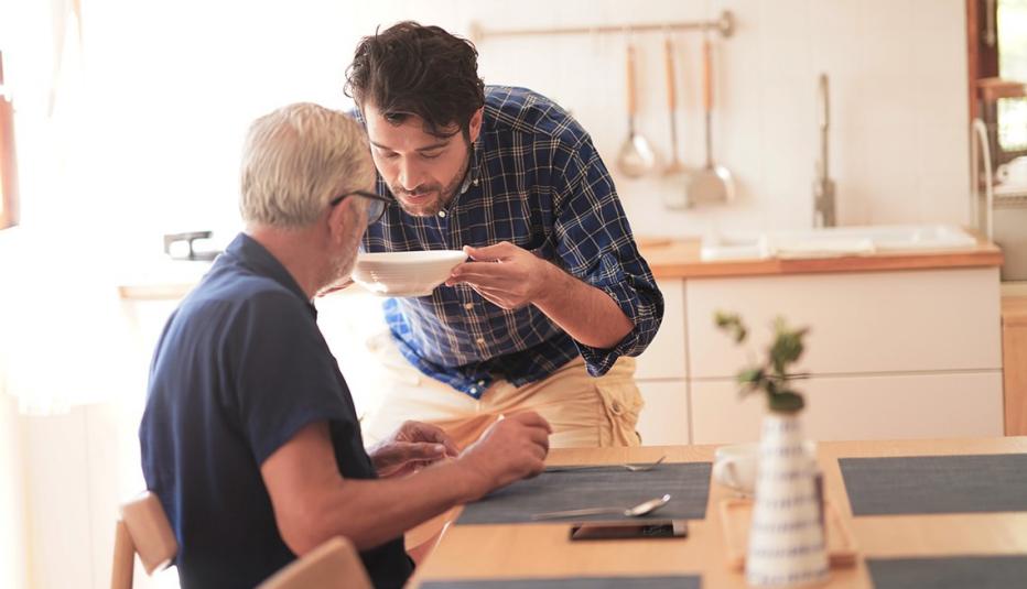 Son caring for older father at home Son caring for older father at home