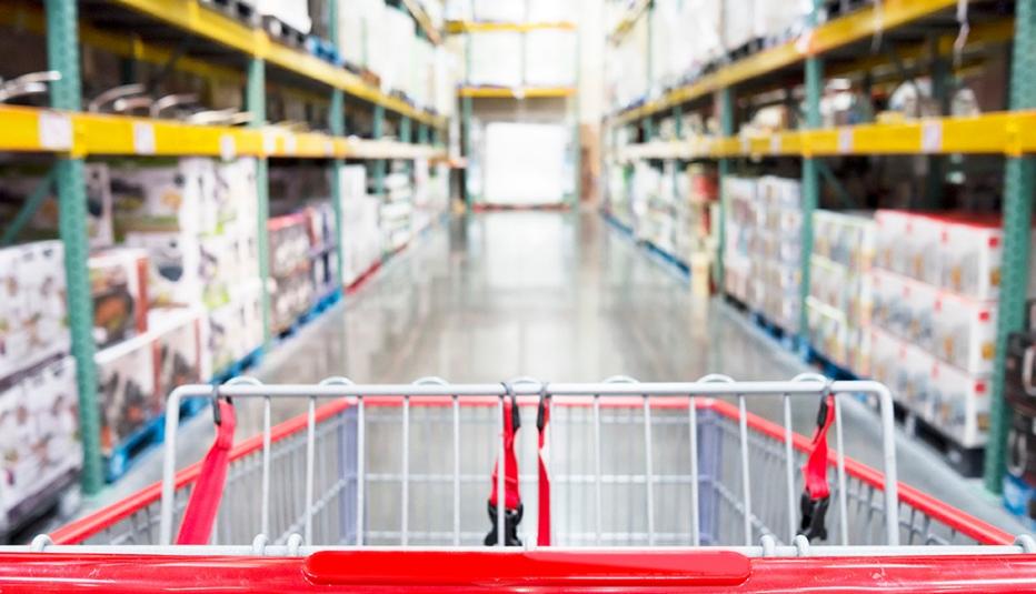 Interior warehouse super store from view of shopping cart in store aisle.