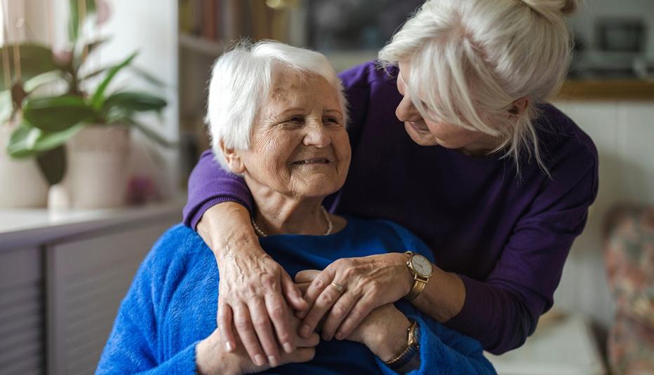 Woman hugging her elderly mother