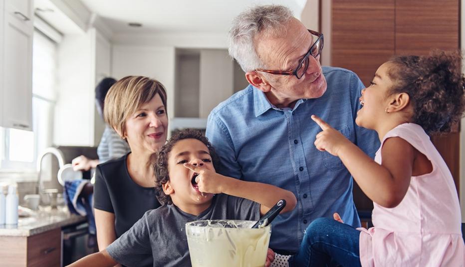 Grandparents making cupcakes with grandchildren Grandparents making cupcakes with grandchildren