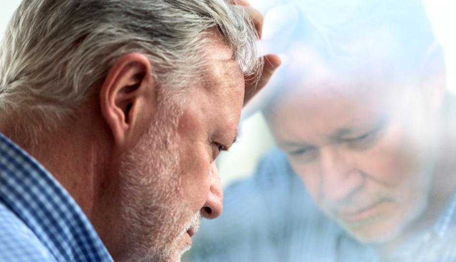 Concerned Senior Man at Window Concerned Senior Man at Window