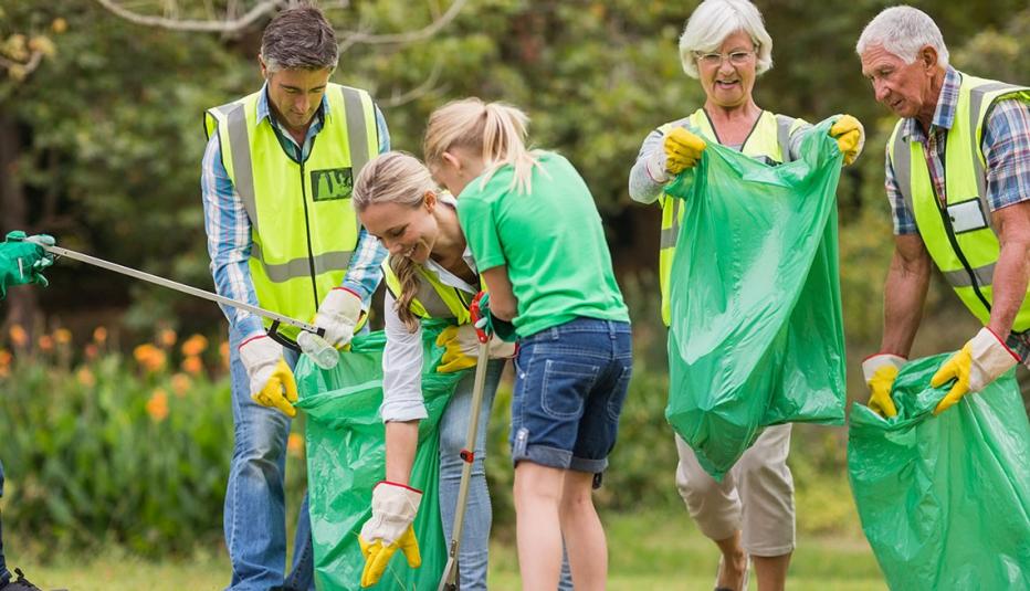 Happy family picking up rubbish