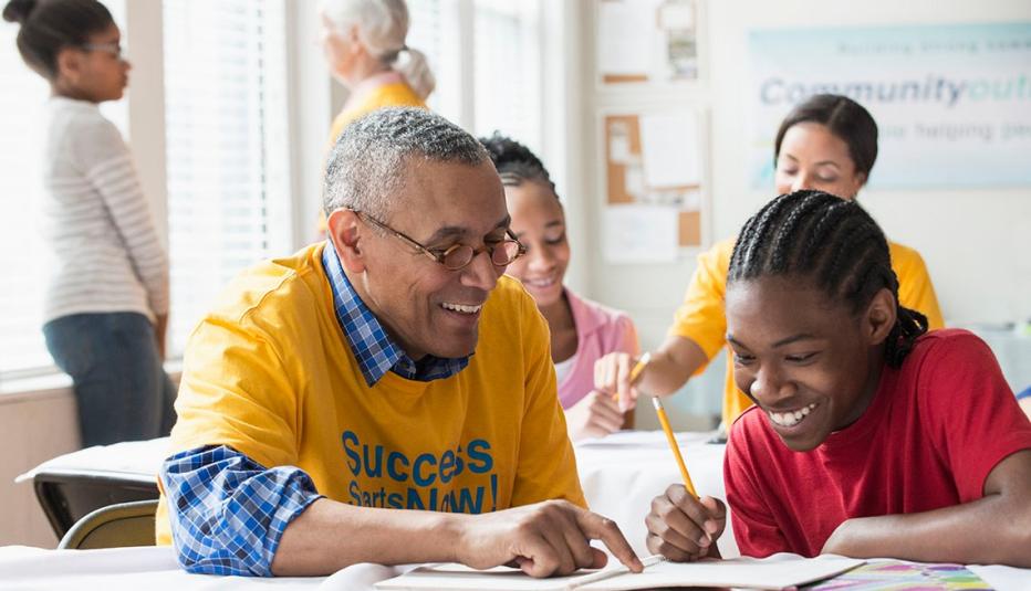 Vounteers tutoring students in classroom