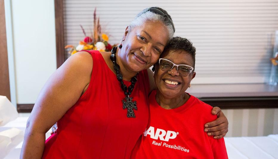 Two AARP Volunteers Hugging