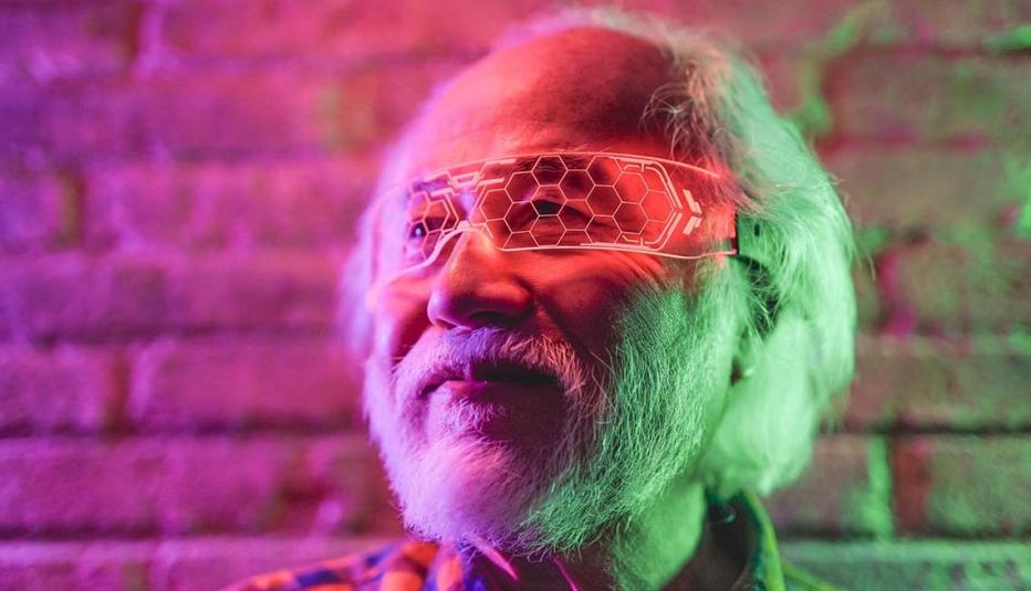 Older man looking out through virtual reality goggles