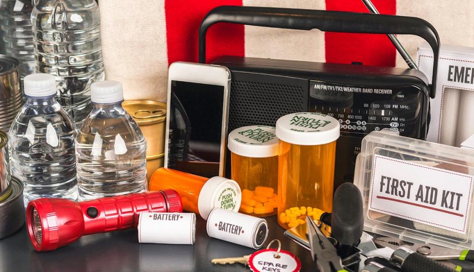 Disaster Preparation Kit Items on Gray Table Disaster Preparation Kit Items on Gray Table