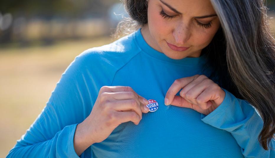 A woman wearing a voting badge