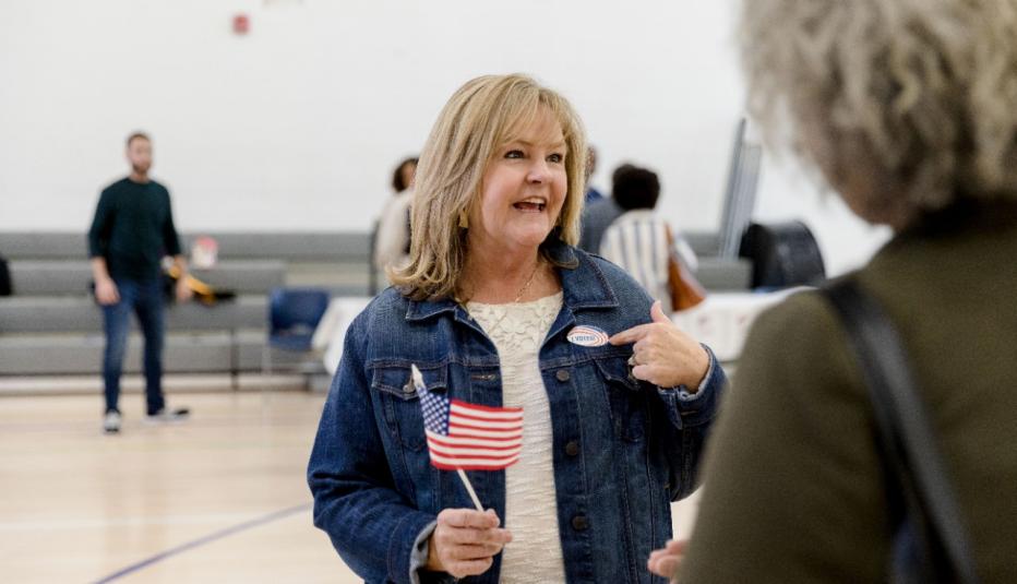 Older Woman Voter Showing Voting Sticker