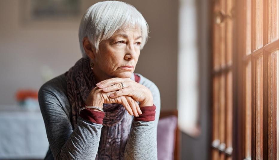 older woman looking out a window