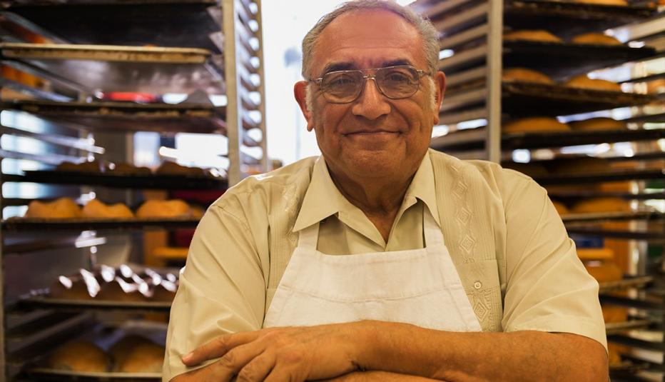 Hispanic baker working in commercial kitchen