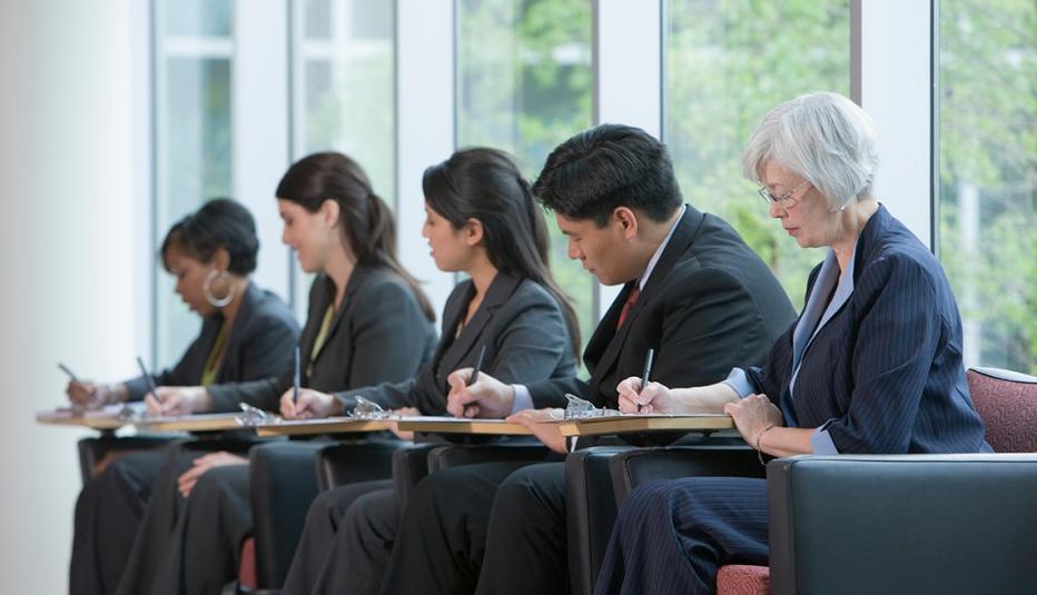 Job seekers filling out applications