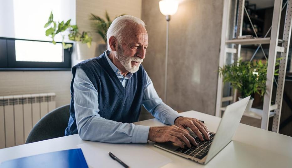 Older man looking at a laptop