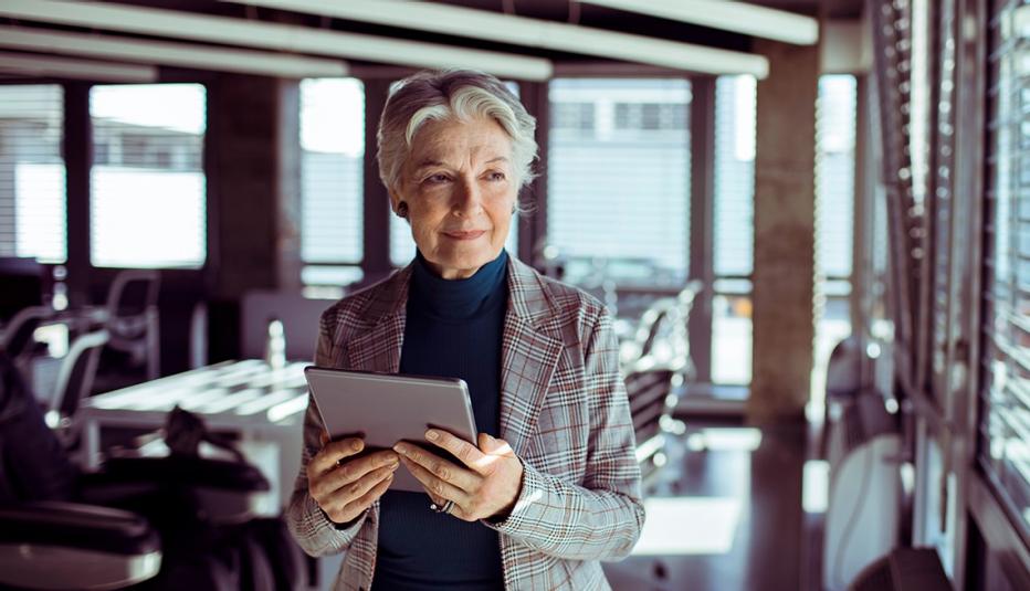 Mature Businesswoman with Tablet at Work