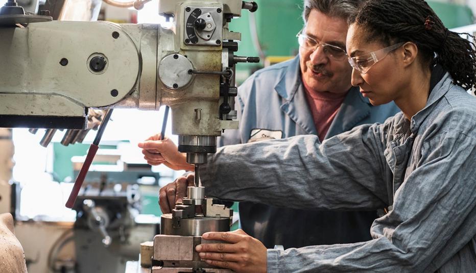 A Worker Learning How to Operate a Drill Press