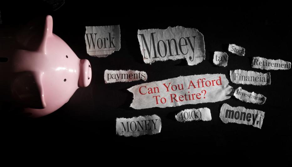 472151052 Retirement related newspaper headline with piggy bank