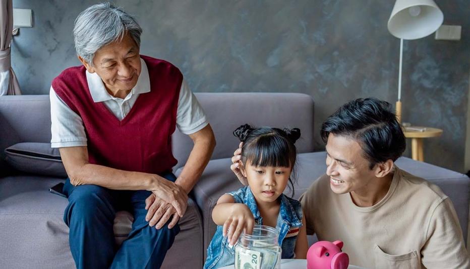 Multi generation family showing younger generation on saving and investing Multi generation family showing younger generation on saving and investing