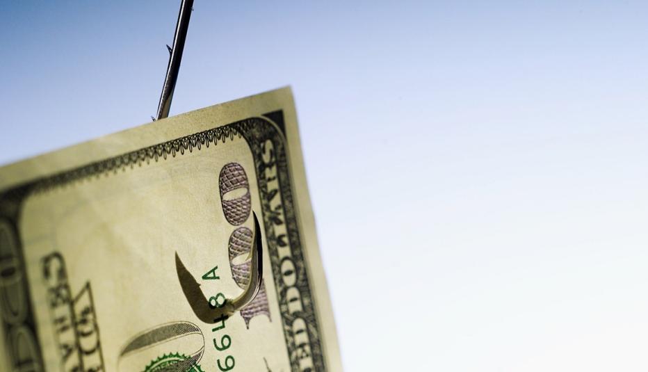 Hundred dollar bill on a fishing hook