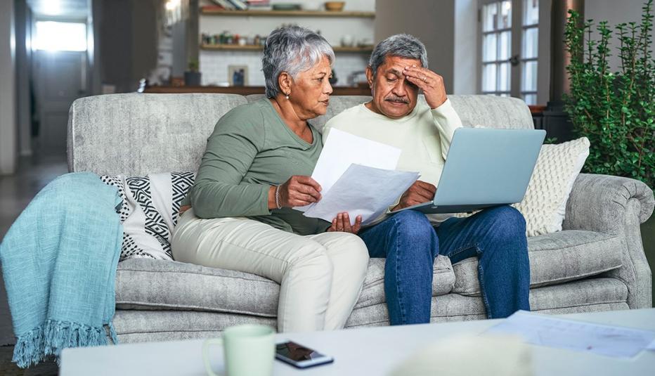 Older couple looking at bills