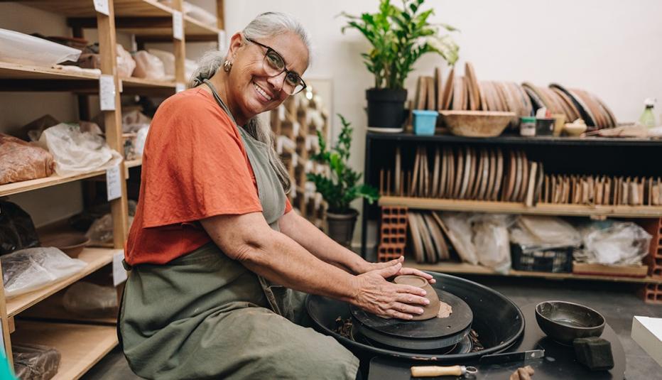 Portrait of a senior woman on pottery class at a ceramics workshop