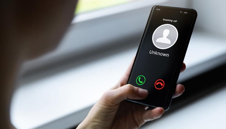 Woman Holding Smartphone with Unknown Caller Woman Holding Smartphone with Unknown Caller
