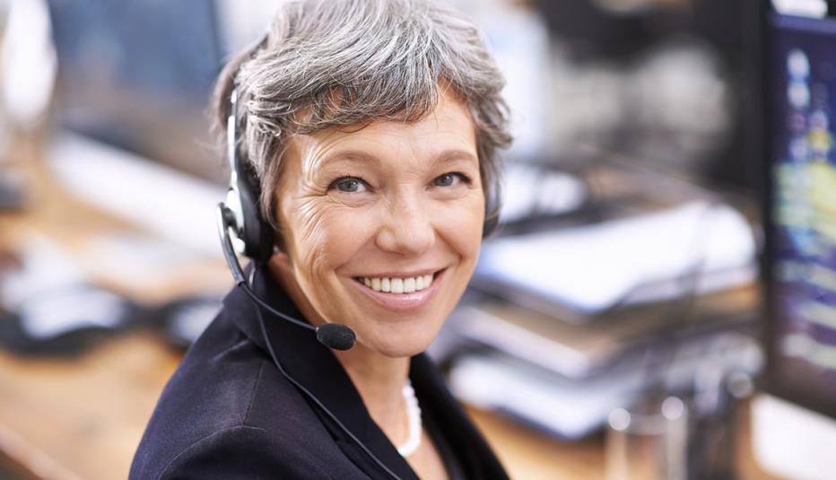 Shot of an mature female call center representative wearing a headset
