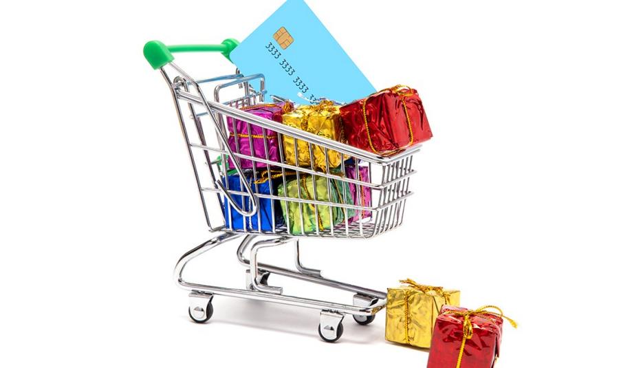 Shopping cart with gift boxes and credit card Shopping cart with gift boxes and credit card