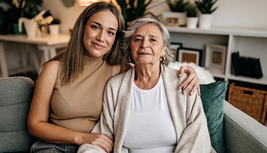 Senior women and her granddaughter talking in living room
