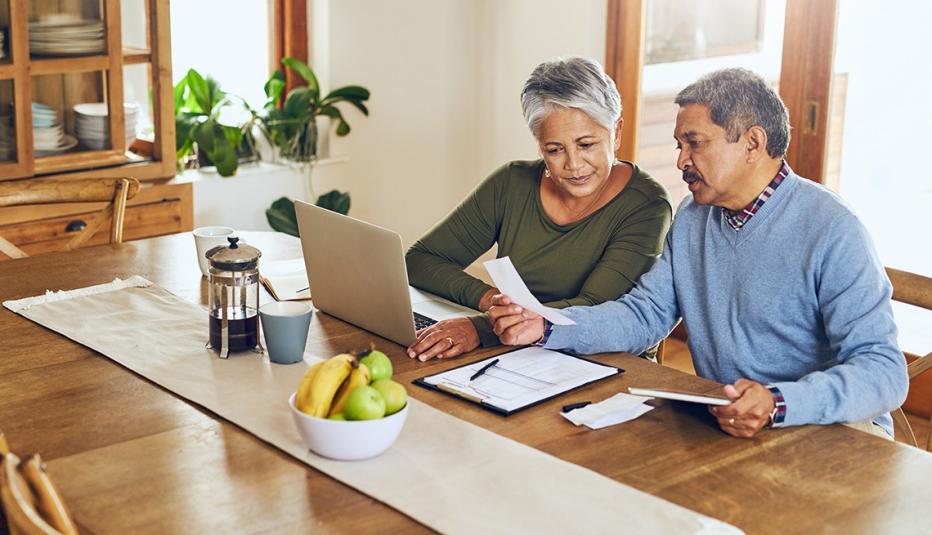 Couple manages paperwork at home