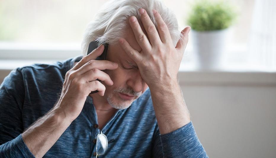 Frustrated older man on the phone