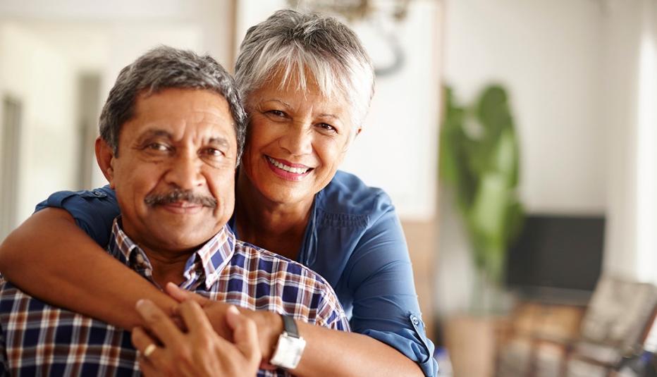 Woman with her arms around her husband