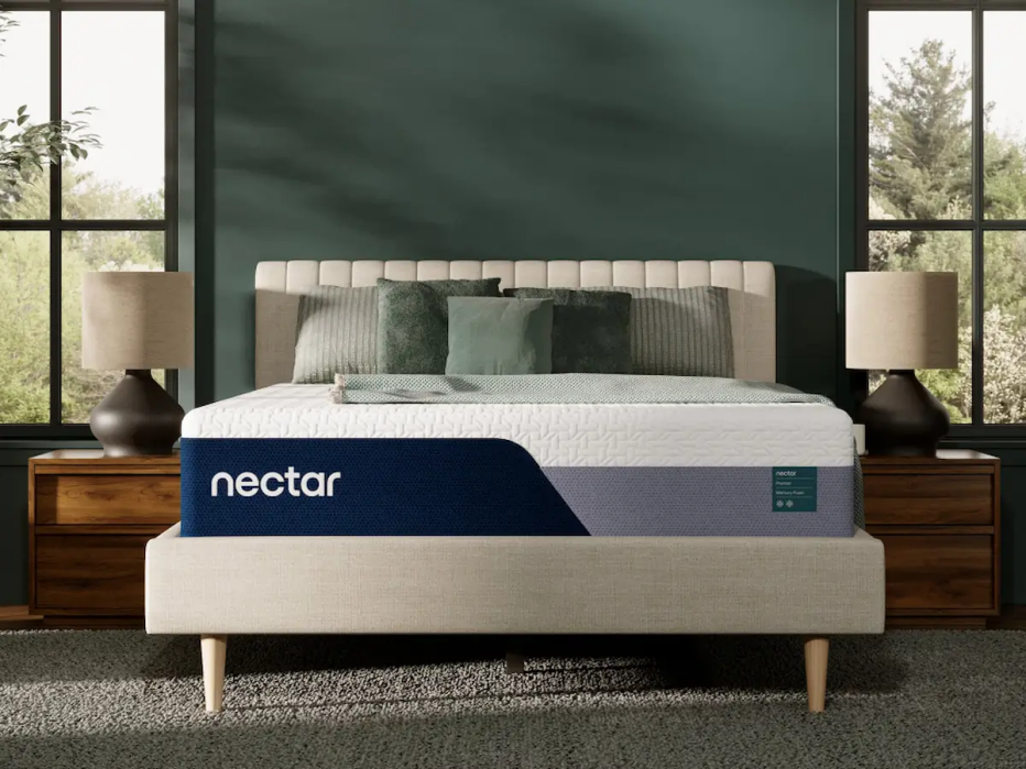 The Nectar Premier Memory Foam mattress in a green bedroom.