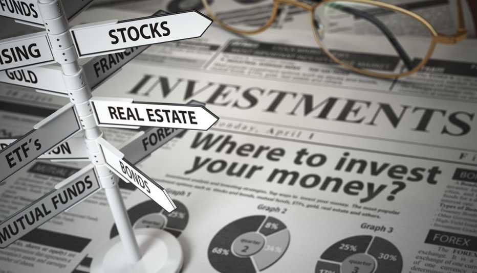 newspaper and direction sign with investment options