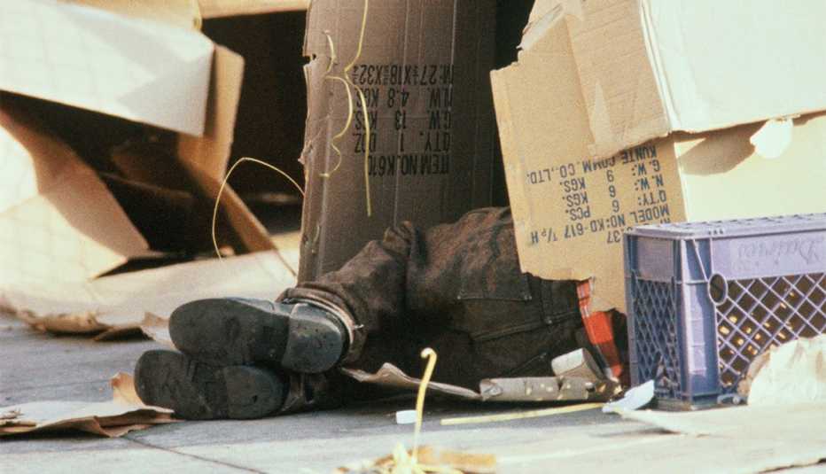 a homeless person sleeping on the street