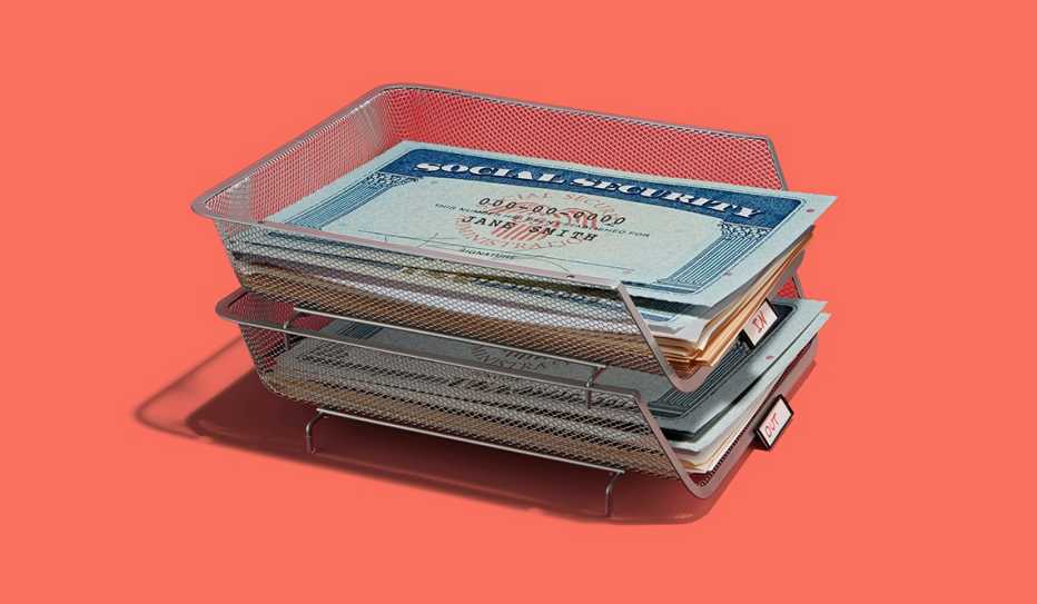 inbox and outbox that both have stacks of mail topped with social security cards