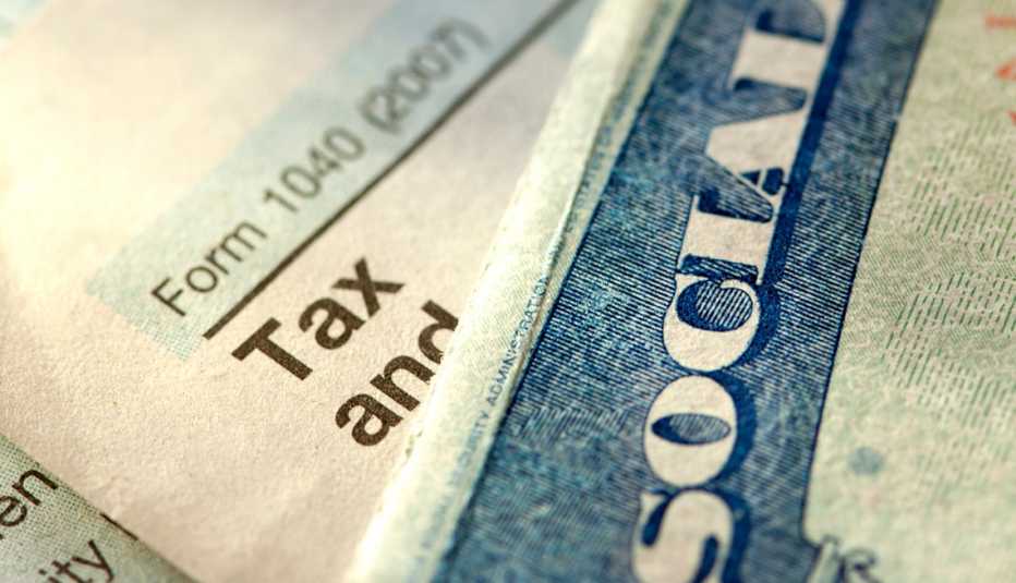 a Social Security card lying on top of a tax form