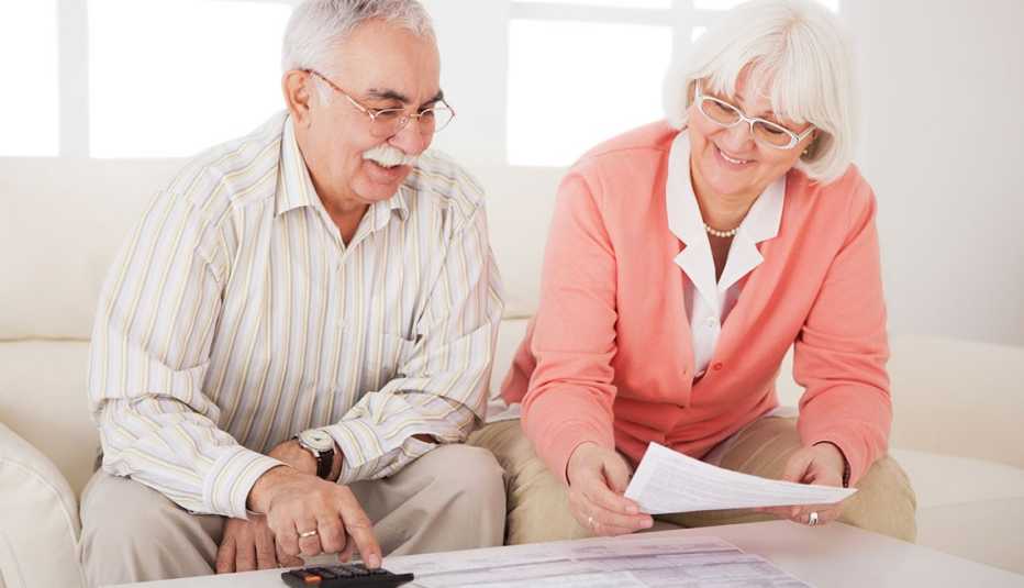 Mature adults filling taxes
