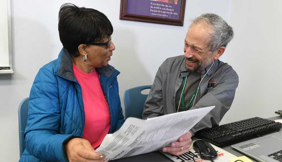 older woman receiving help with taxes