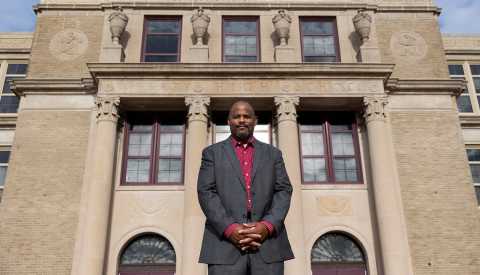 principal doctor harrison bailey the third in front of his school liberty high school