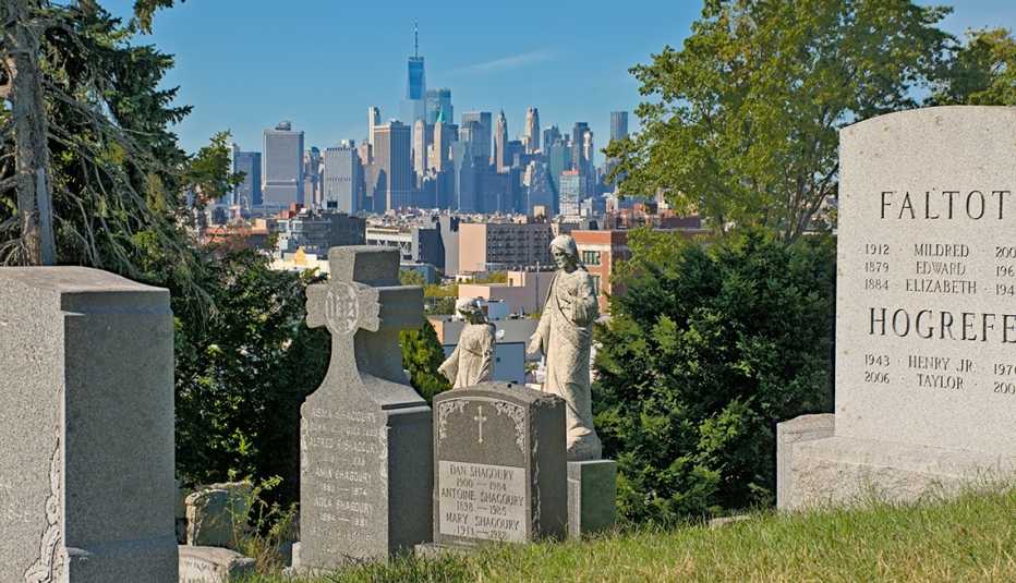 tombstones of green-wood cemetery with manhattan in the background tombstones of green-wood cemetery in brooklyn on a sunny day