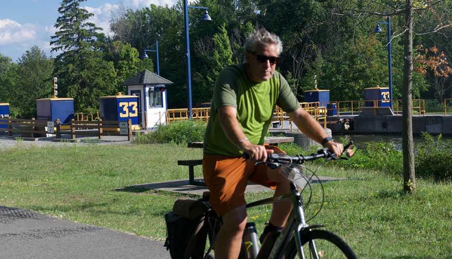 man riding bike on pavement