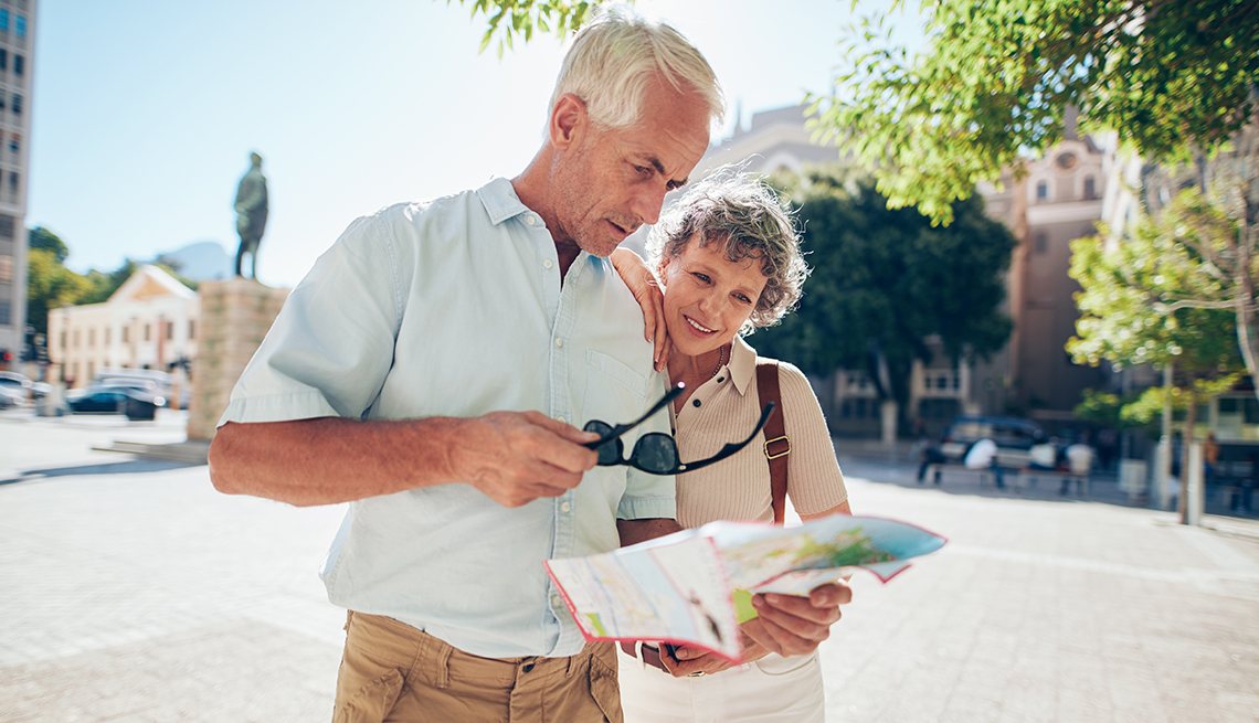 couple looking at a map while on vacation