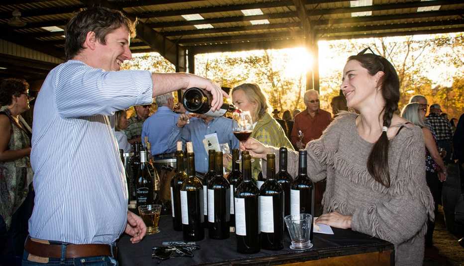 a woman sampling wine at a sonoma valley vineyard in california