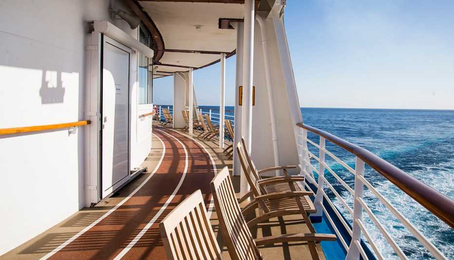 chairs on deck of boat overlooking water